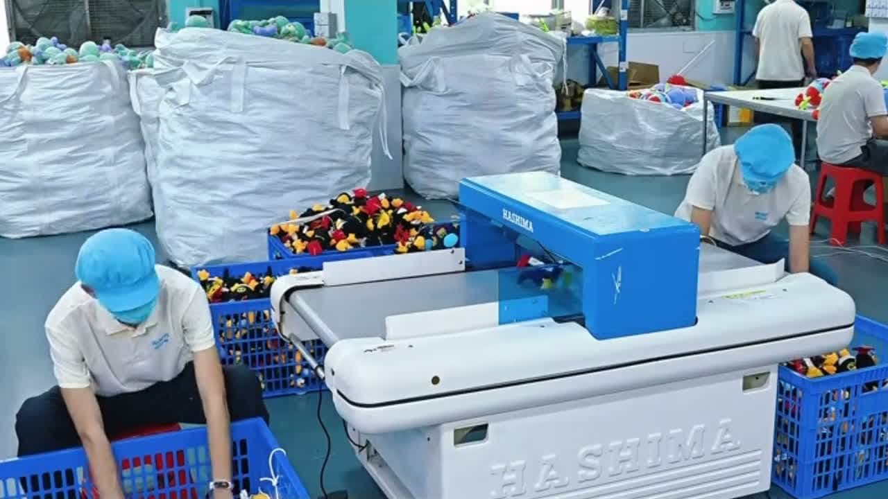 Quality-control inspection of custom plush toys at the factory