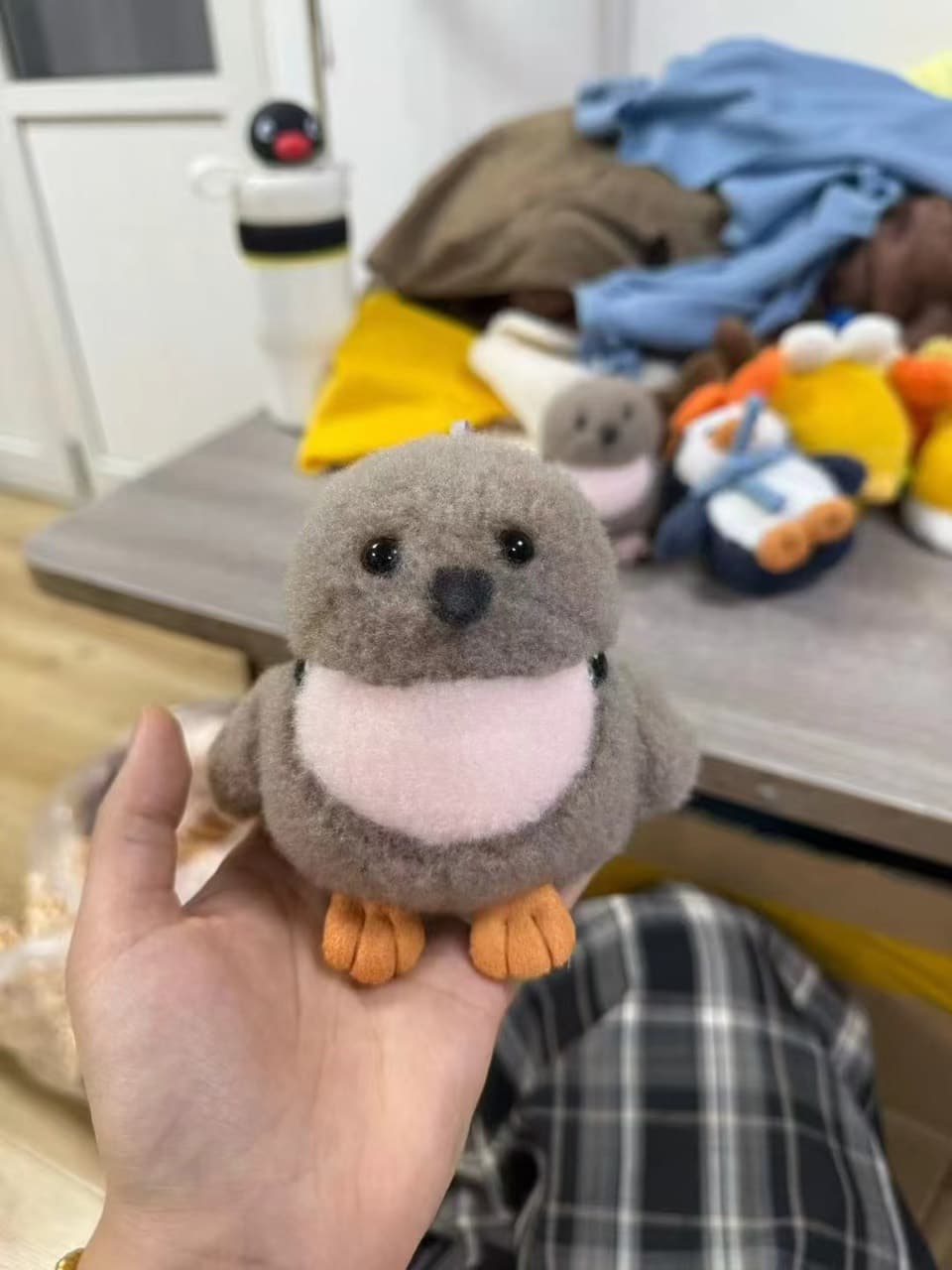 Fluffy bird stuffed animal with detailed fur