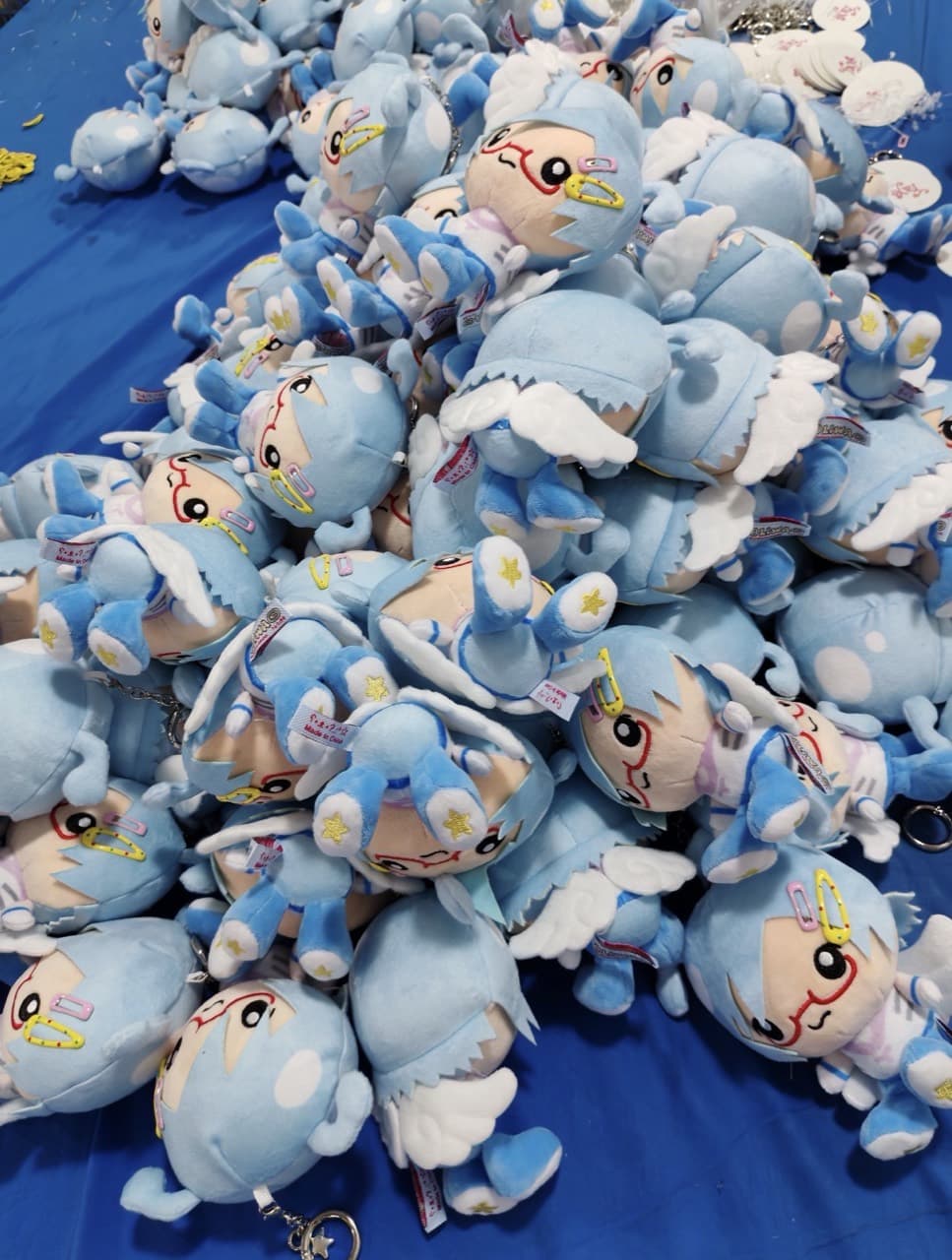 Custom plush keychains in bulk production at the factory