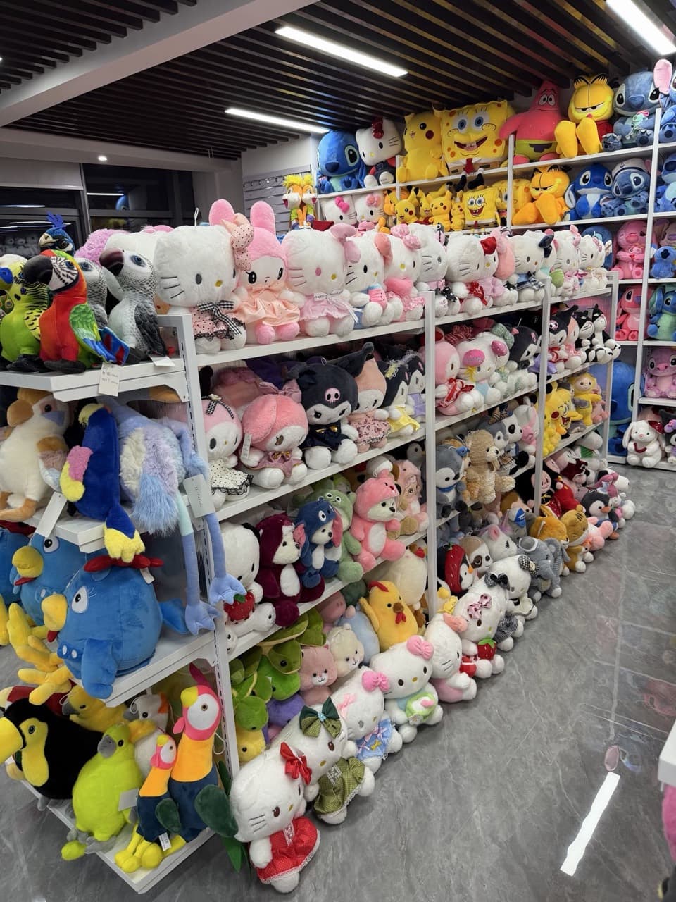 Plush toy factory showroom with shelves of stuffed animals