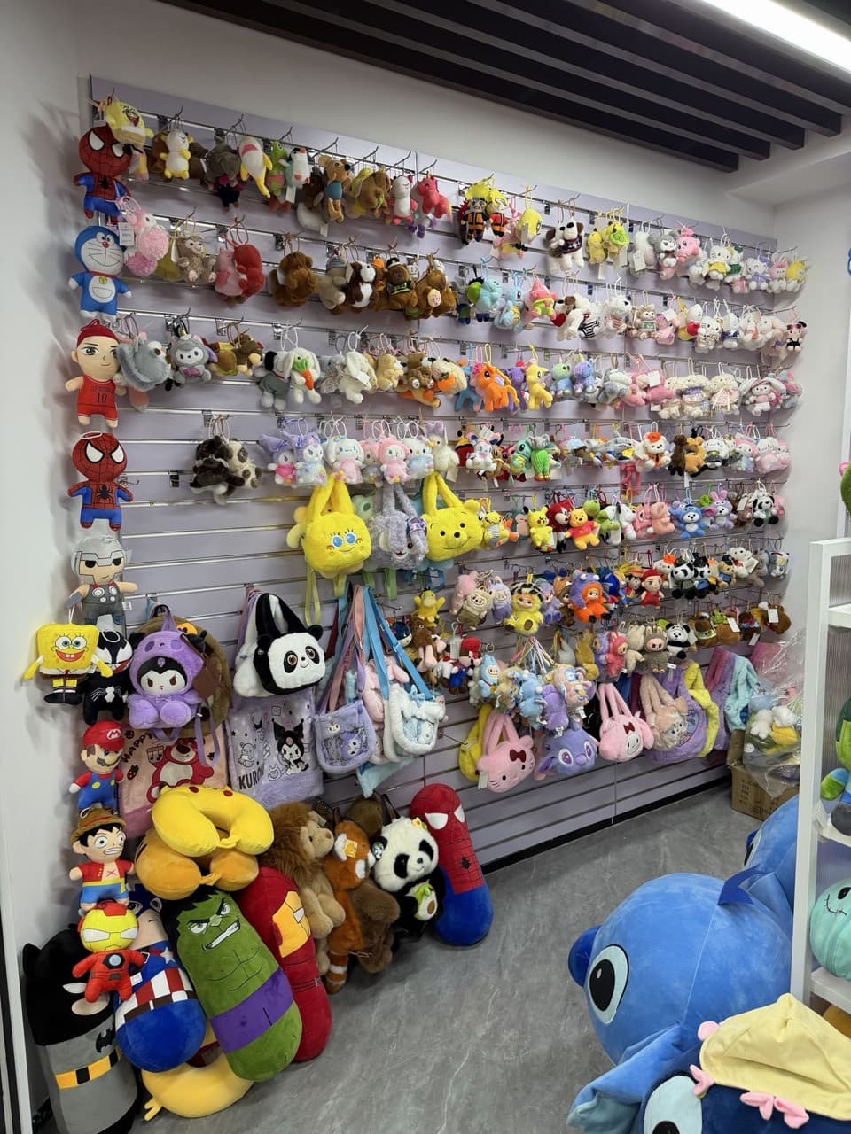 Showroom wall of custom plush toys and keychains