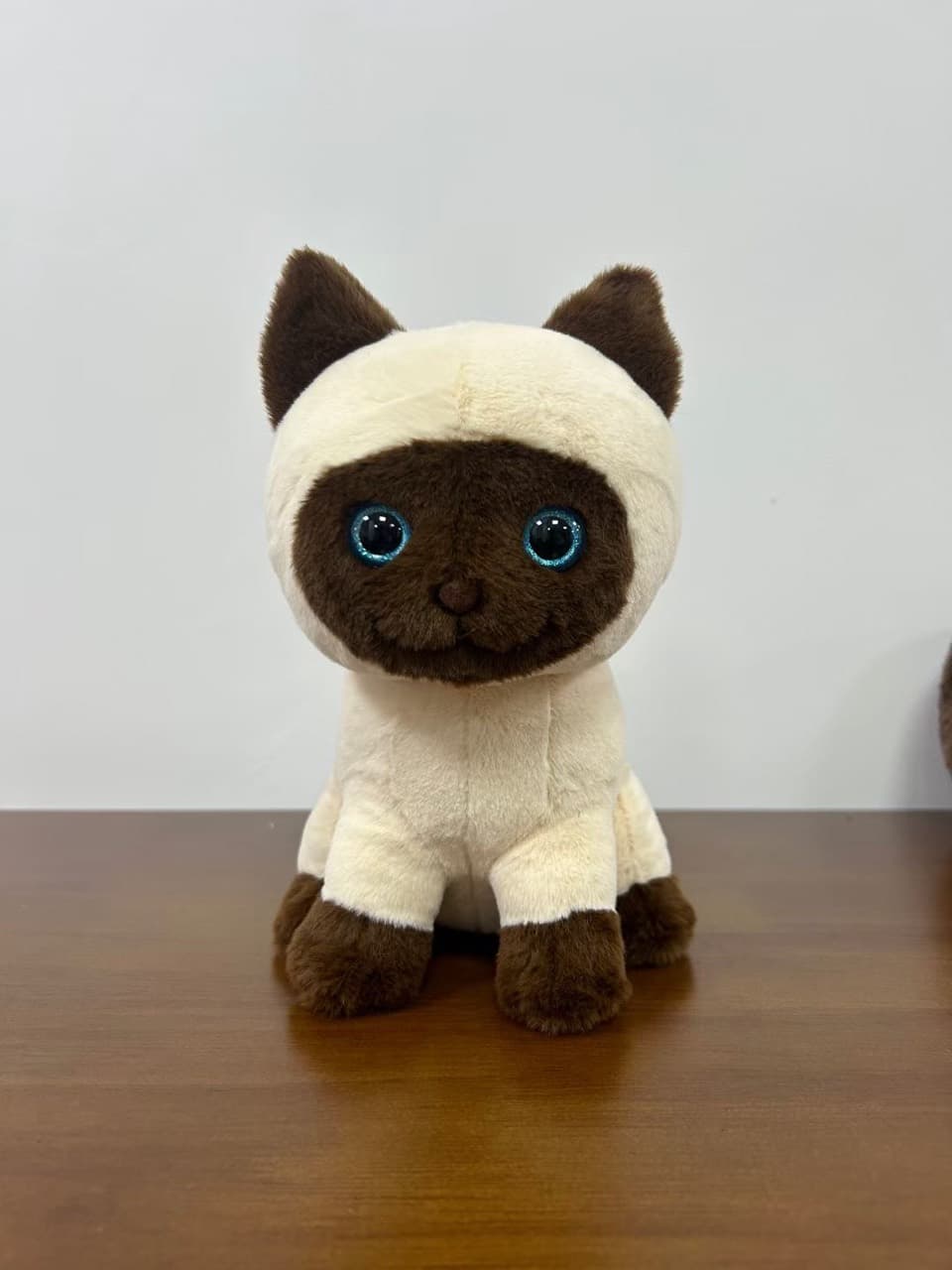 Cream Siamese cat plush toy with blue eyes